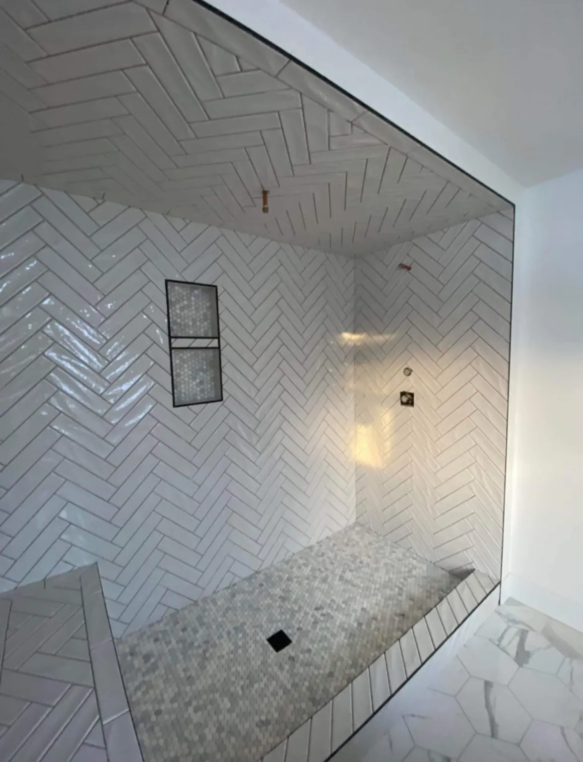 Herringbone tile shower finish